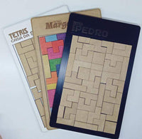 Três versões de jogos Tetris: MDF, MDF com melamina branca e MDF pintado de preto, em fundo branco.